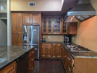 Wood kitchen cabinets color cherry.