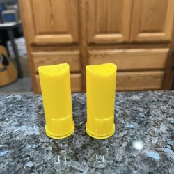 Vintage 1950’s Plastic Yellow Pair of  Salt and Pepper Shakers.  Size approximately 2 1/2 inches tall.  Preowned.  