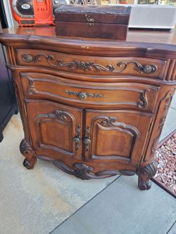 French Provincial Wood Cabinet with Carved Details