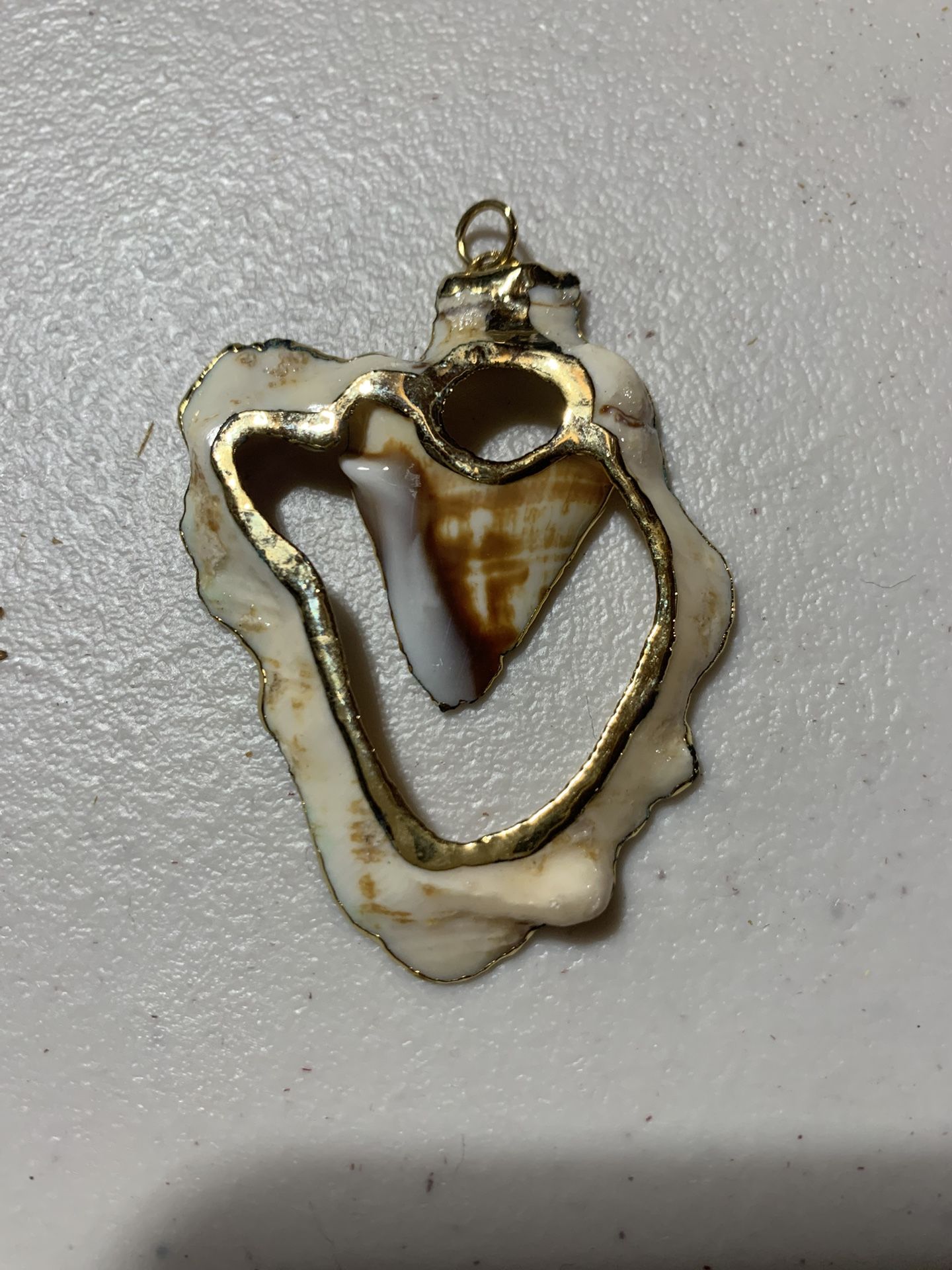 Shell Pendant Trimmed In Gold
