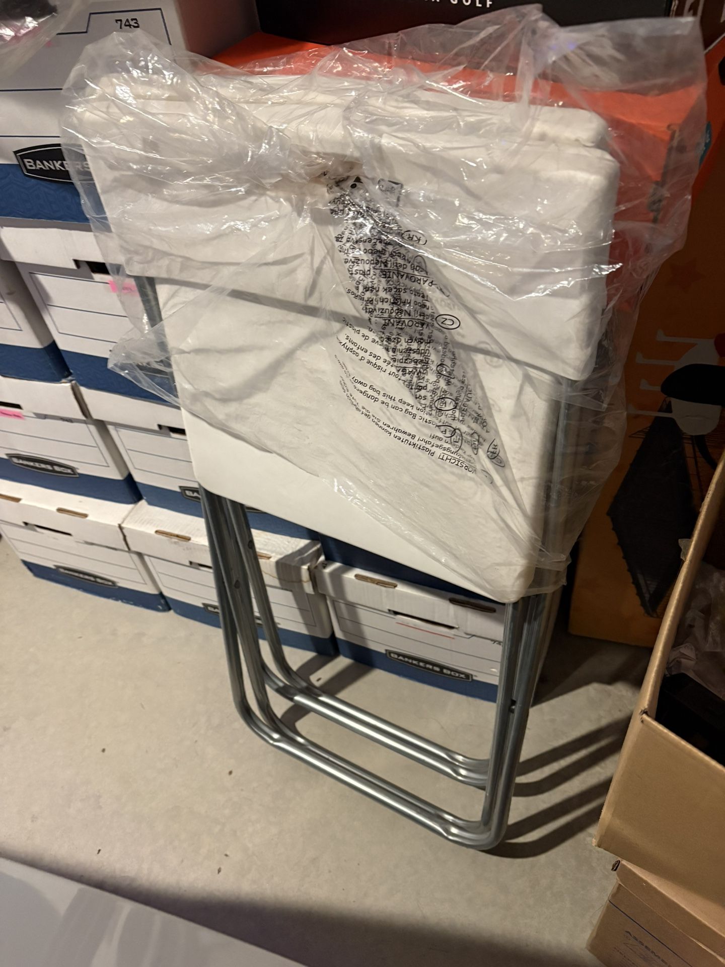 2 white foldable chair