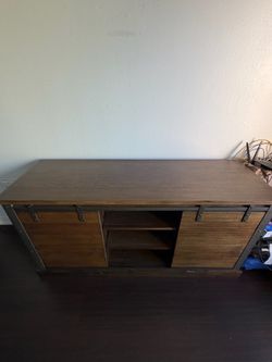 Tv stand , Measurements are 62" wide × 20" deep × 30" high. First person that brings $50 firm take it Costa Mesa