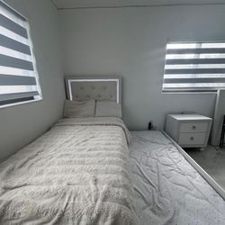 Twin sized bed with trundle and nightstand