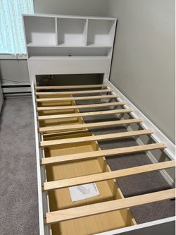 twin-size wooden platform bed in excellent condition.