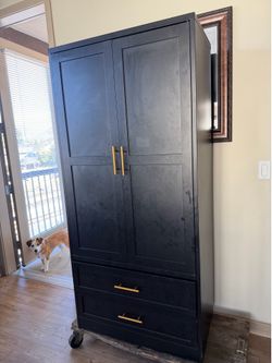 Black metal cabinet with two pull out drawers