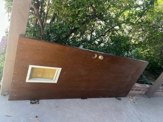 Solid wood exterior door with pet door