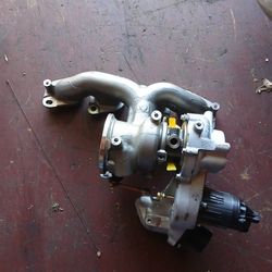 TURBO INTAKE MANIFOLD WITH TURBO!!NOT SURE WHAT IT GOES TO!! 150$ NEW!!