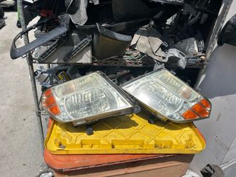 2005-2012 Nissan Pathfinder left driver headlight $120 right passenger headlight $120