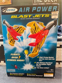 Estes Blast Jets air-powered rocket launcher set, featuring a red and yellow tiger-striped airplane glider.