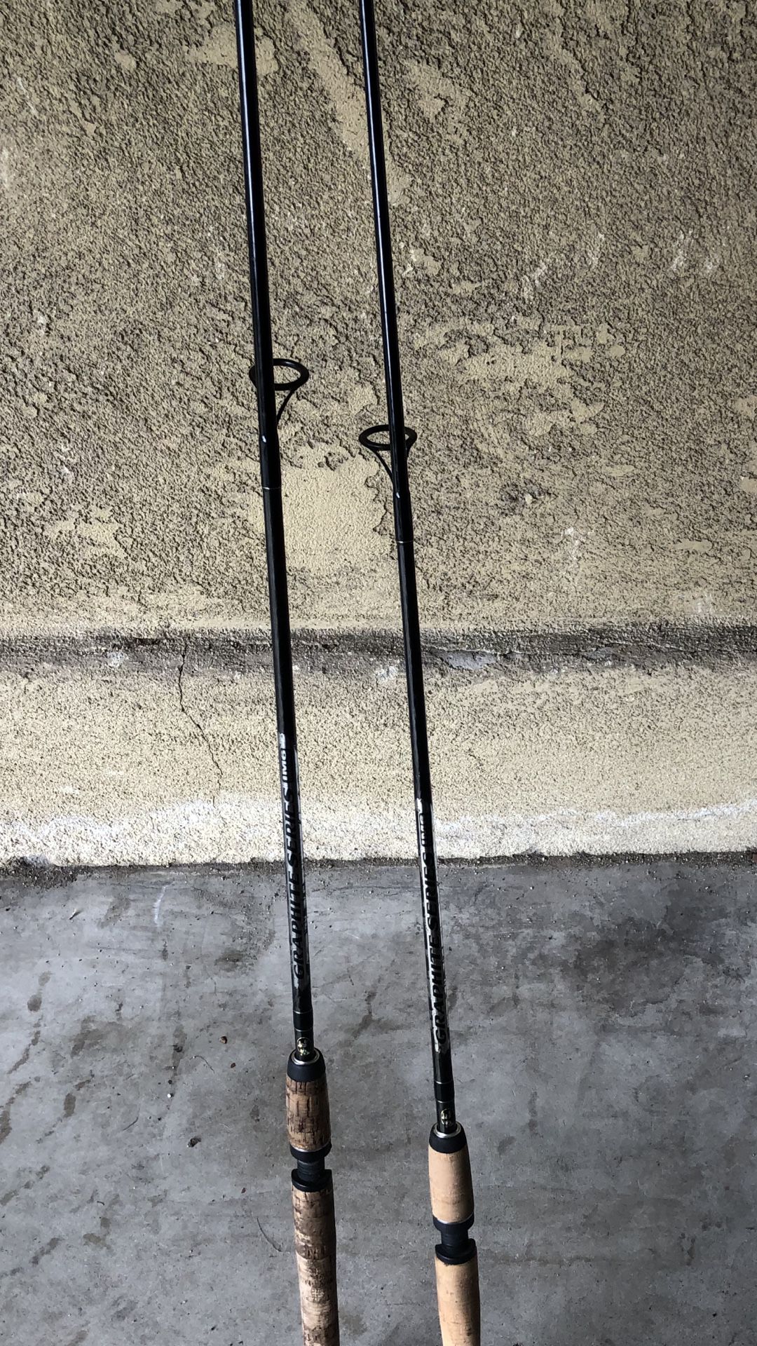 Two bass pro shops graphite series spinning rods