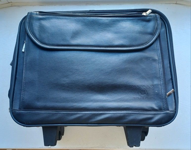 Brookwood Travelers Original Leather Rolling luggage with handle...was $200 new.
