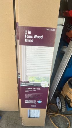 Home Decorators Collection faux wood blind features durable, moisture-resistant slats for room darkening.