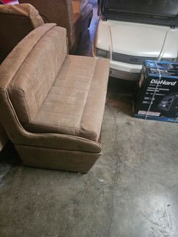 Motorhome dinette with table sliding drawers