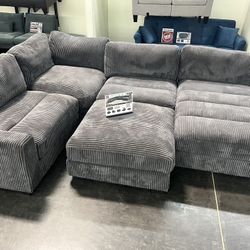 New 5 Piece Corduroy Modular Sectional.  Grey.  90” X 127” X 66”.  Free Delivery!