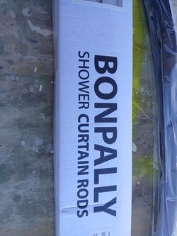 Two brand new curtain rod sets Brass and silver coated