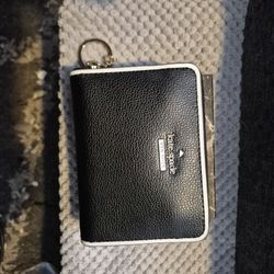 Kate Spade New York Leila Medium L-Zip Wristlet in 100% black leather. 