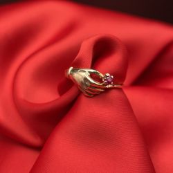 14k Gold Ring Hand Holding A Ruby Stone-July Birthstone