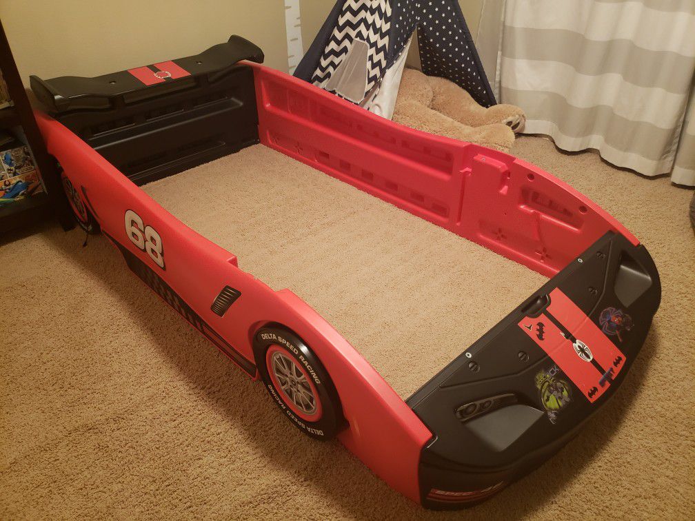 Delta Red Race Car Bed Frame comes with lightening McQueen decals.