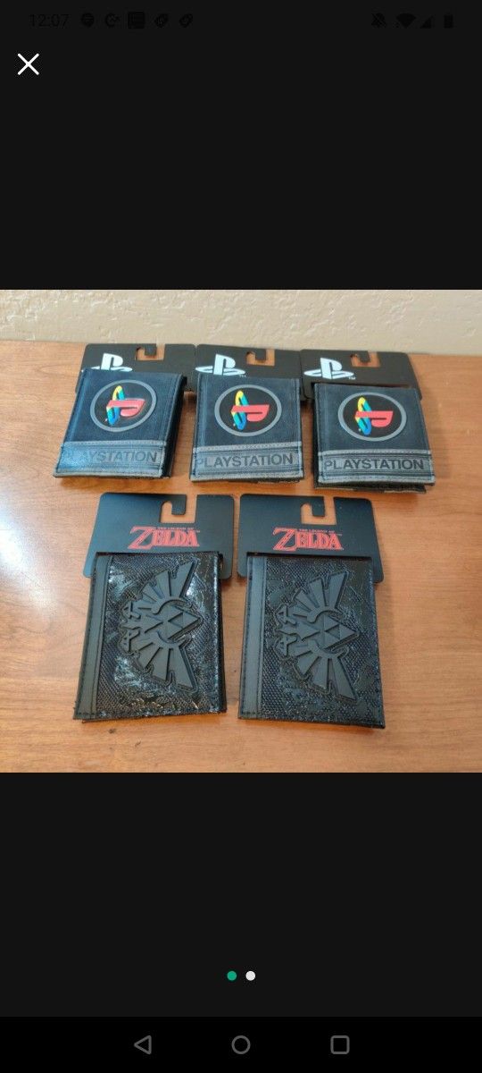 Wallet Brand New Zelda And Sony PlayStation Black Wallets $8 each . Very cheap bought them for $16 each with tax.
