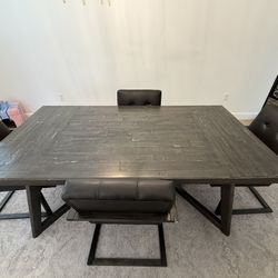 Wooden Table And Leather Chairs 