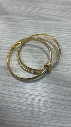 Three Bracelets Connected With One Golden Color 