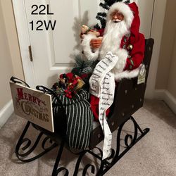 Handsome Santa with a bejeweled  upholstered sled 