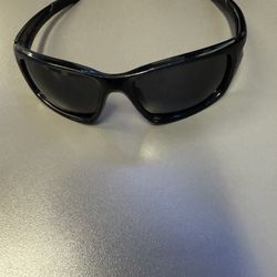 Oakley Valve sunglasses, model OO9236-01, a popular performance lifestyle pair blending sporty durability with everyday style.