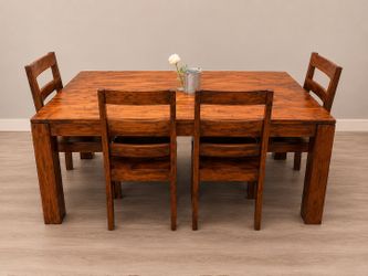 Solid wood dining table located in POMONA