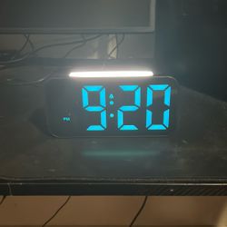 digital alarm clock with a large LED display