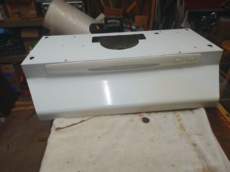 Broan-NuTone white under-cabinet convertible range hood.