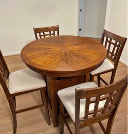 Round wood table with 4 chairs