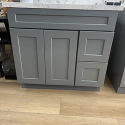 36-inch vanity with adjustable drawer and sink position (left or right). Solid wood cabinet with countertop — special price.