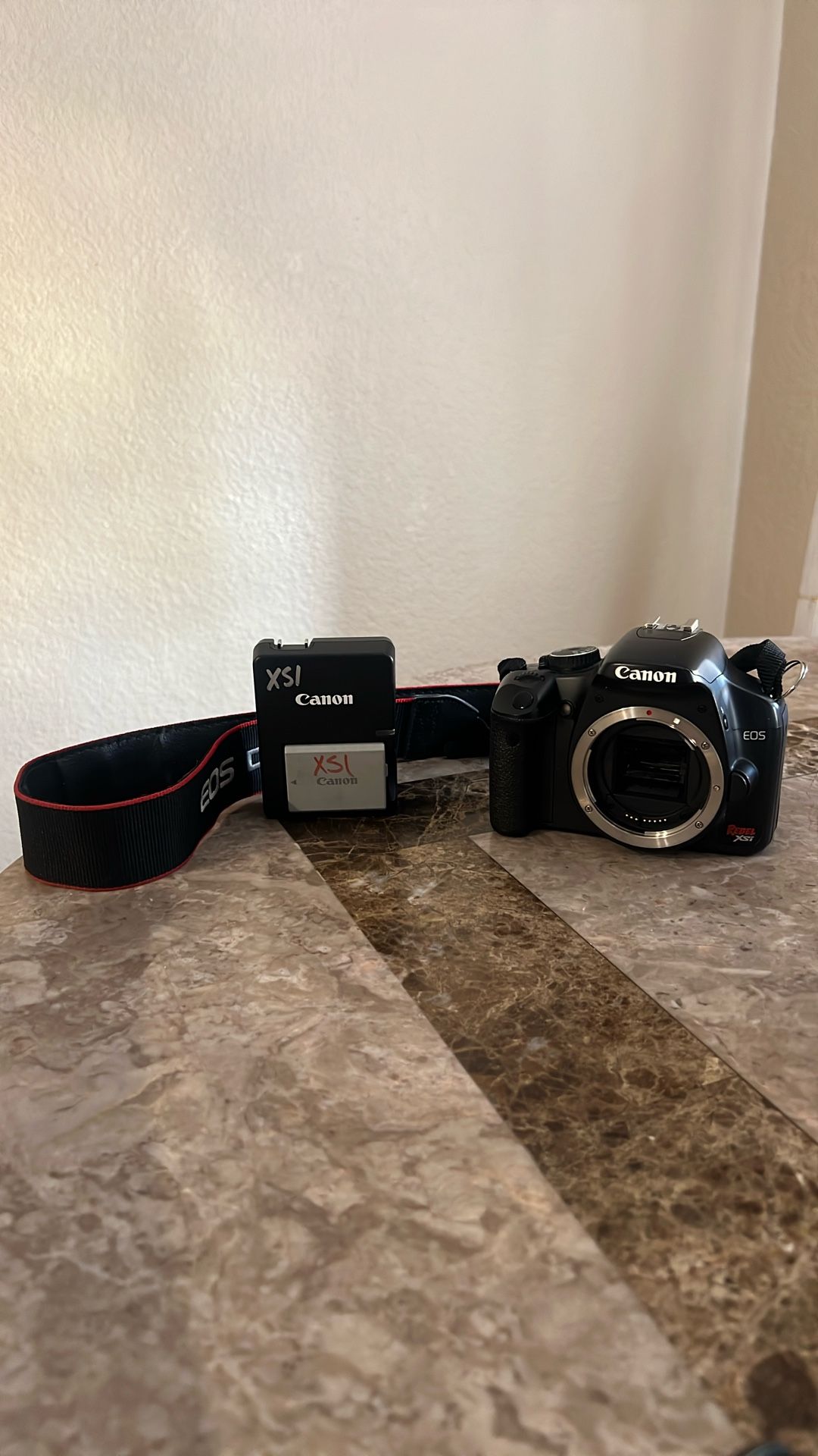 Canon EOS Rebel XSi DSLR camera (Body Only)  – Includes Battery & Charger