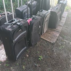 LOTS OF NICE PULL ALONG LUGGAGE 