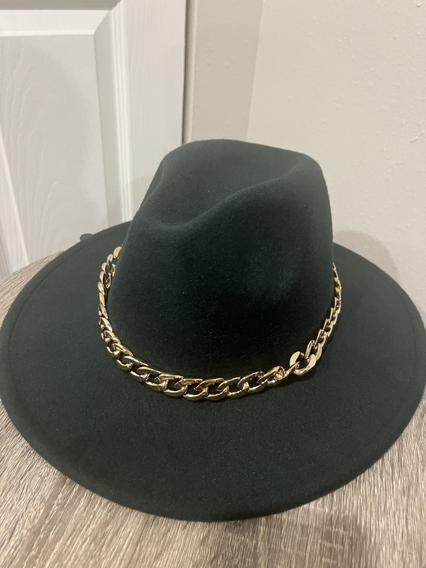 A dark Green cowboy Hat 