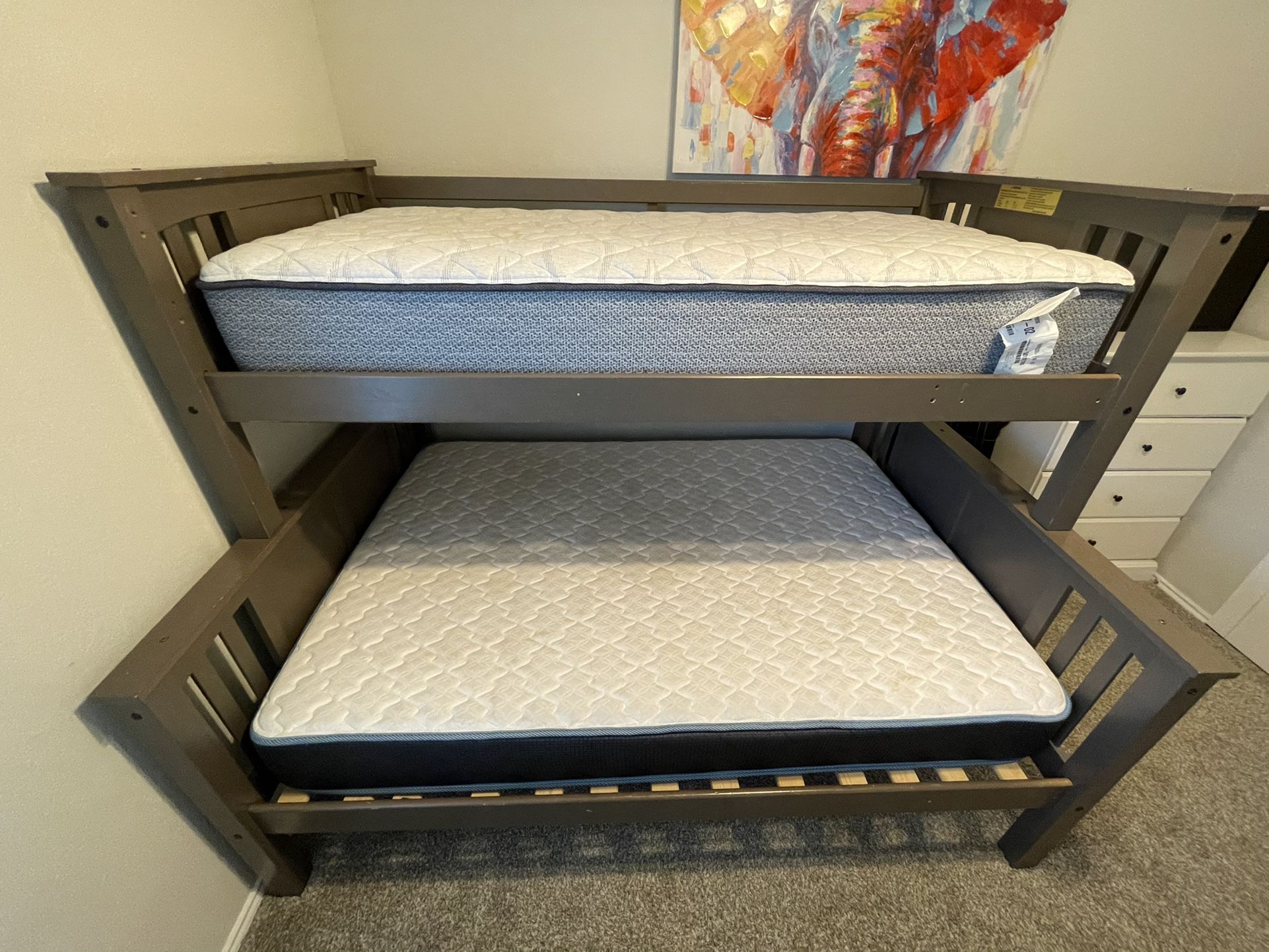 Bunk bed, twin upper bunk and full lower bunk.