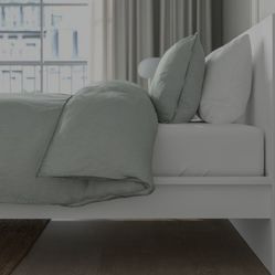 Ikea Peoduct , white king-size bed with a very sturdy wooden frame!