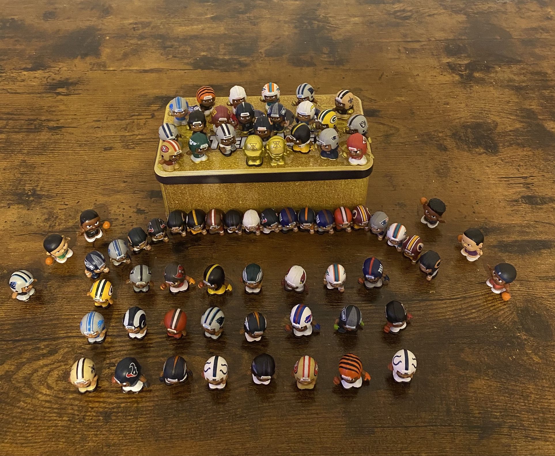 Teeny Mate Figures Along With Gold Characters And Players