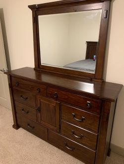 clairfield tobacco dresser Kentifield Solid Wood Eight Drawer Dresser in Black Drifted Oak (2024) Resting on a plinth base Faria Dresser