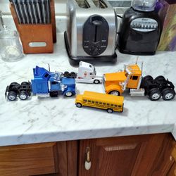 2 Kenworth Truck's And A Schopl Bus And Simply Truck.