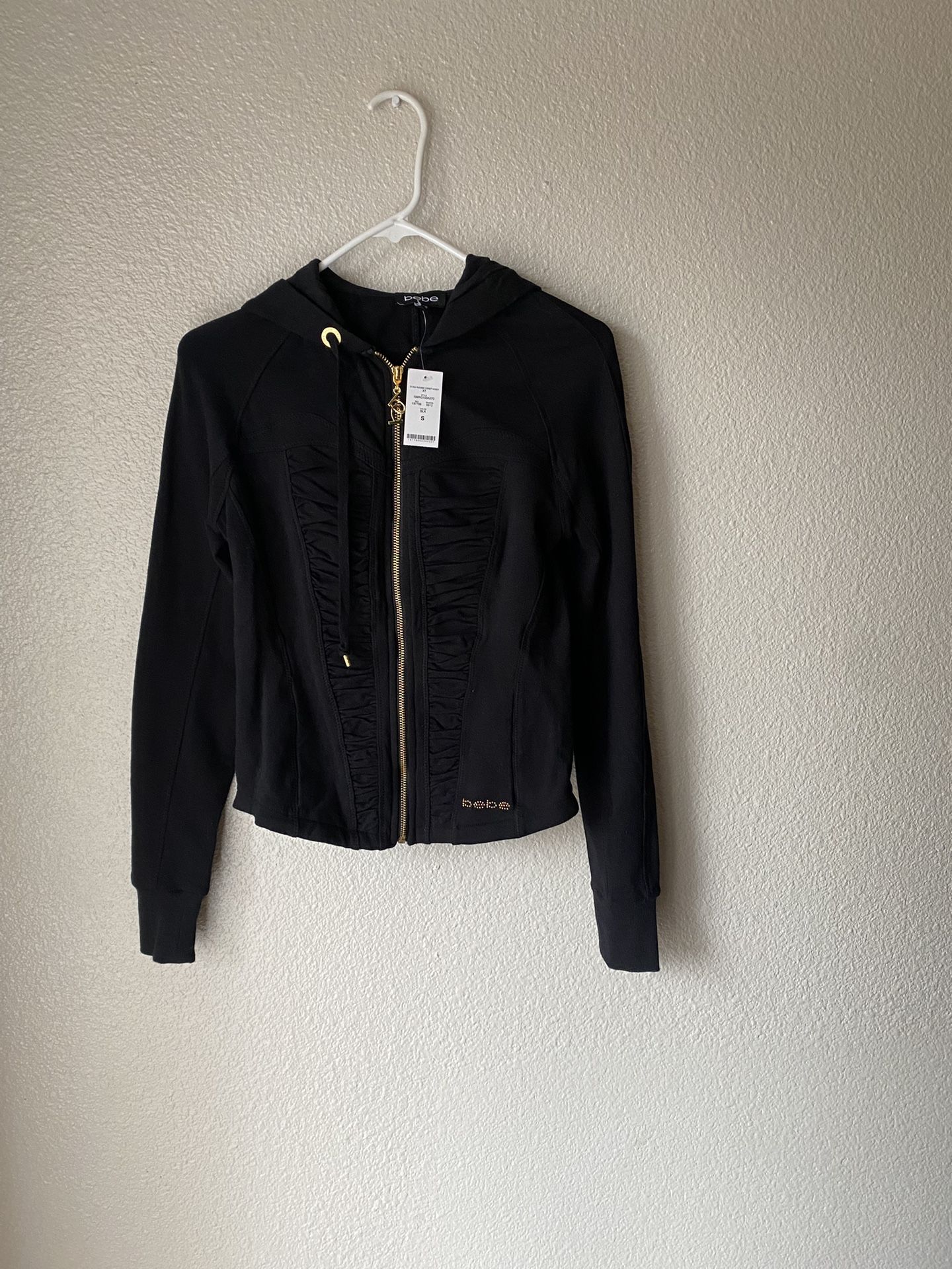 Brand new woman’s Bebe brand black jacket up for sale