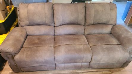 Reclining light brown sofa