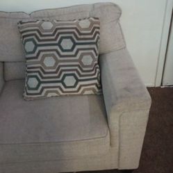 Couch With Oversized Chair And Decorative Pillows