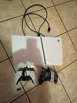 PlayStation 5 with two controllers