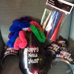 New Year’s Eve party favors, NEVER USED, 5 full size hats, 5 full sized tiaras, 5 poly leis, 6 party horns, meet at Exxon at 2428 E Lamar Alexander Pa