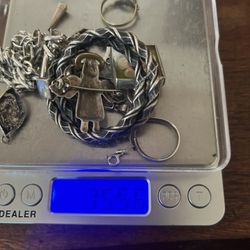 64 GRAMS OF STERLING SILVER