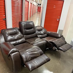 Brown leather reclining sofa