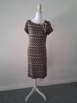 Black dress with cream colored prints and cream colored trim.