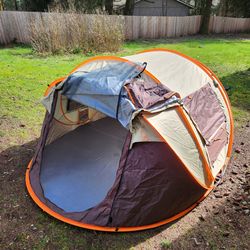 Two 4 person tents. One pop-up and one dome tent.