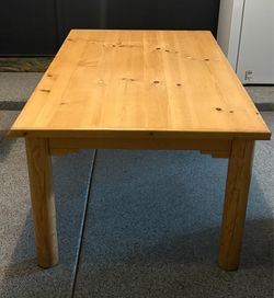 solid pine log dining table, rustic design with cylindrical legs and a natural wood grain 42"x 72"